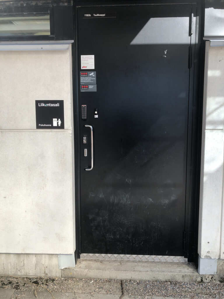 Picture of the door to womens locker room.
