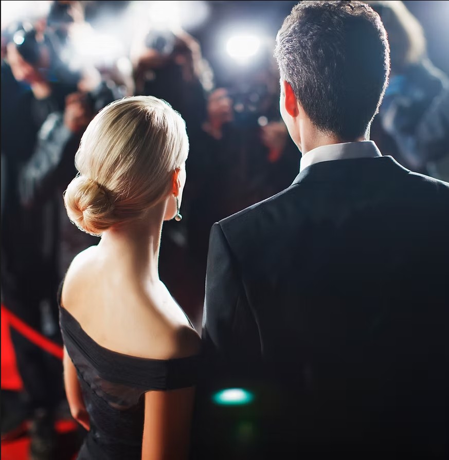 Picture of a couple on a red carpet.
